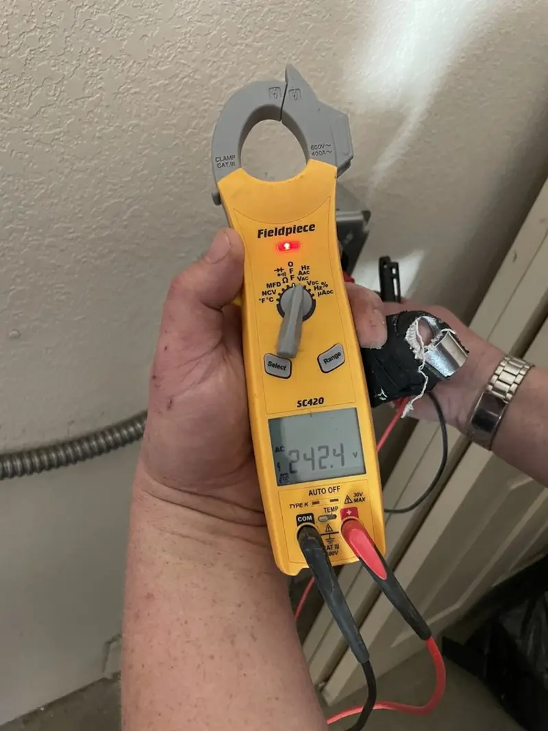 Voltage testing with clamp meter during Electrical Installation Services in Sweetwater